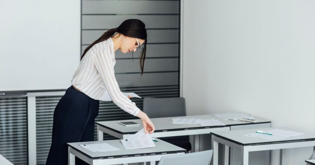 woman in classroom preparing herself for what to expect on the Level 1 CFA exam